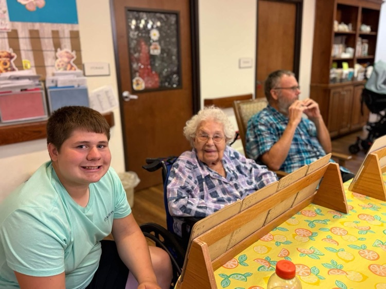 THS StuCo members playing Bingo with Taylor SPJST Skilled Nursing Facility residents.