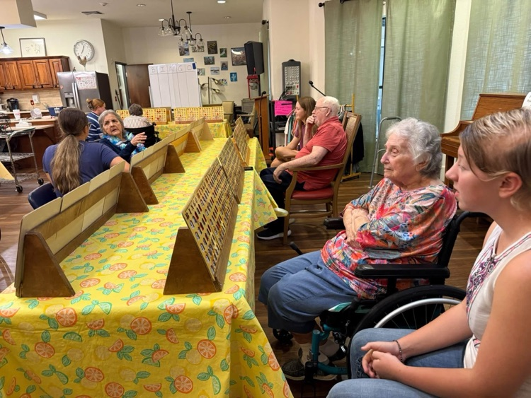 THS StuCo members playing Bingo with Taylor SPJST Skilled Nursing Facility residents.