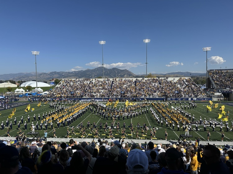 The combined high school and Spirit of the West marching band during the pregame show.