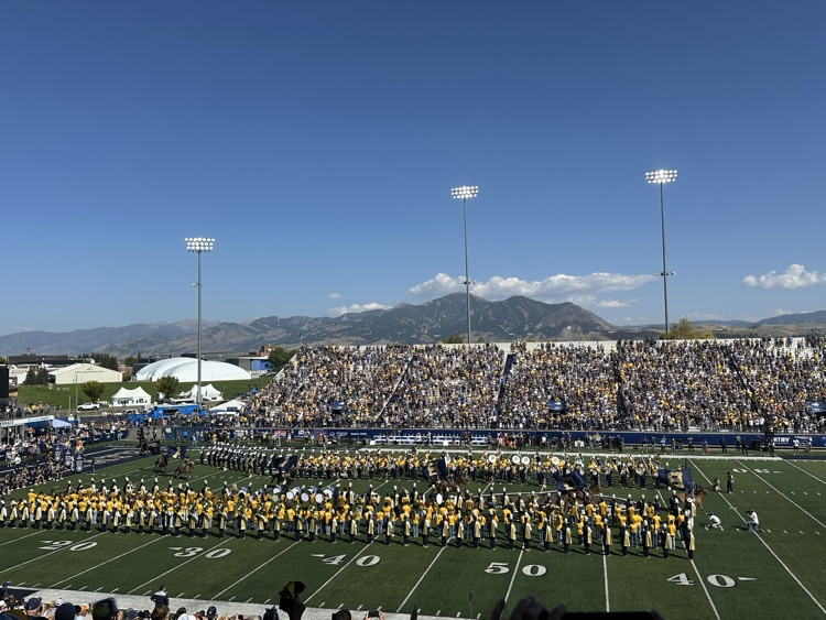 The combined high school and Spirit of the West bands during the pregame show.