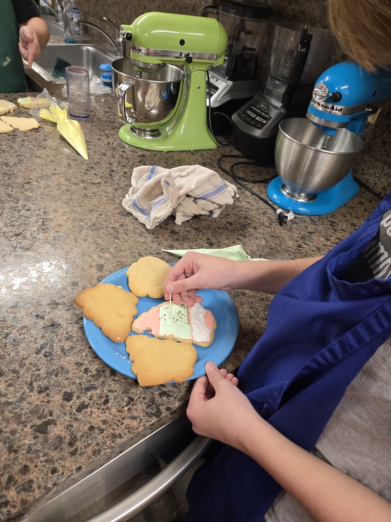 Middle school baked sugar cookies and are learning to flood frosted them for the holidays.