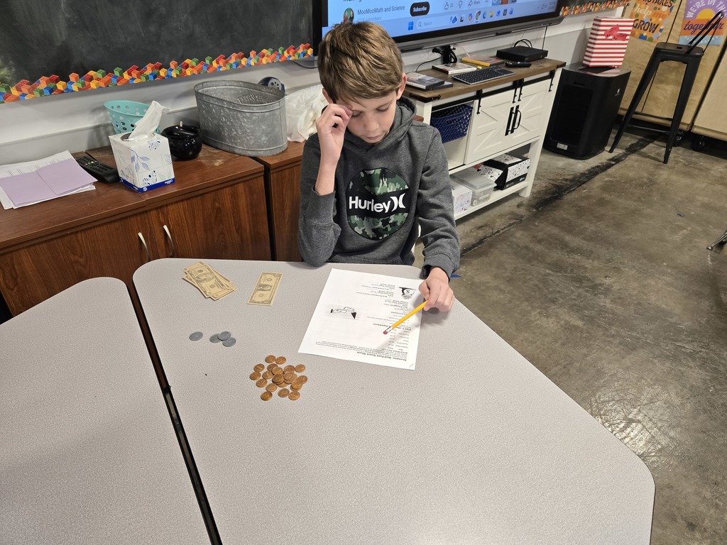 students work through retail scenarios to learn to make change using cash and coins 