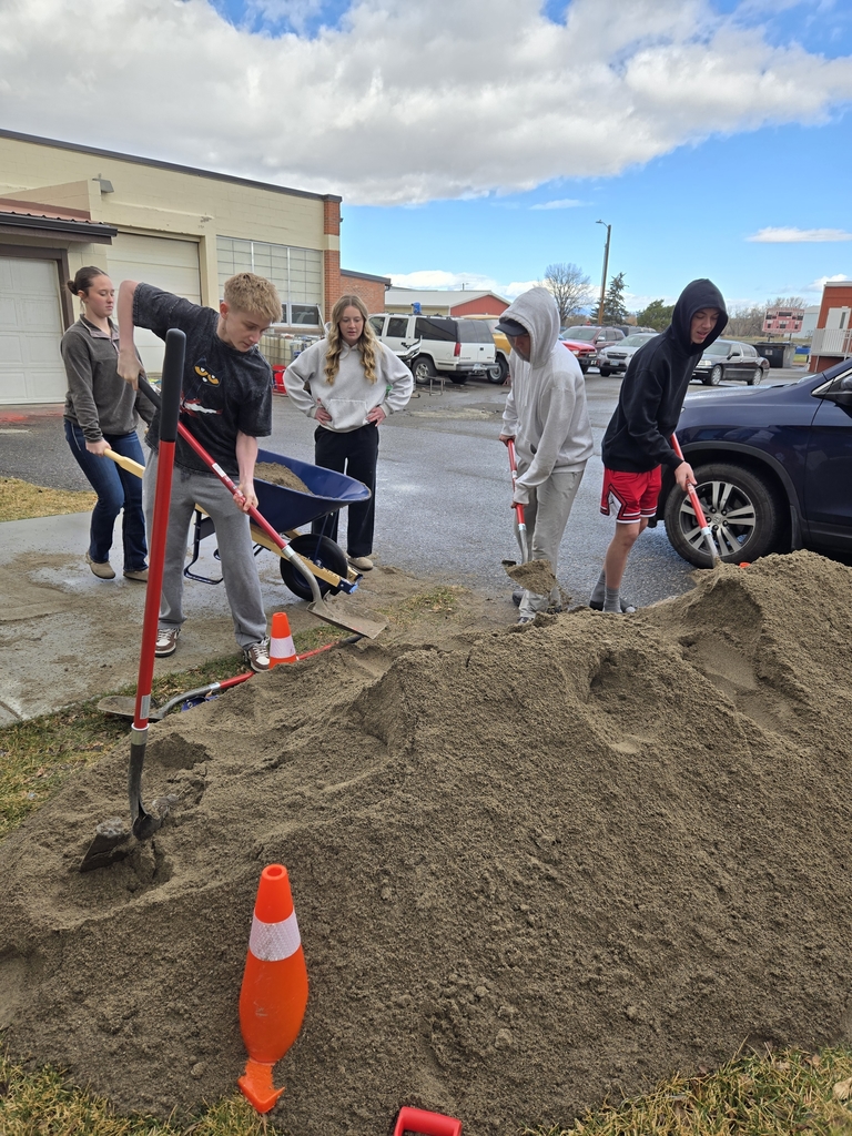 Three yards of sand, in wheel barrow from the parking lot to the courtyard.
