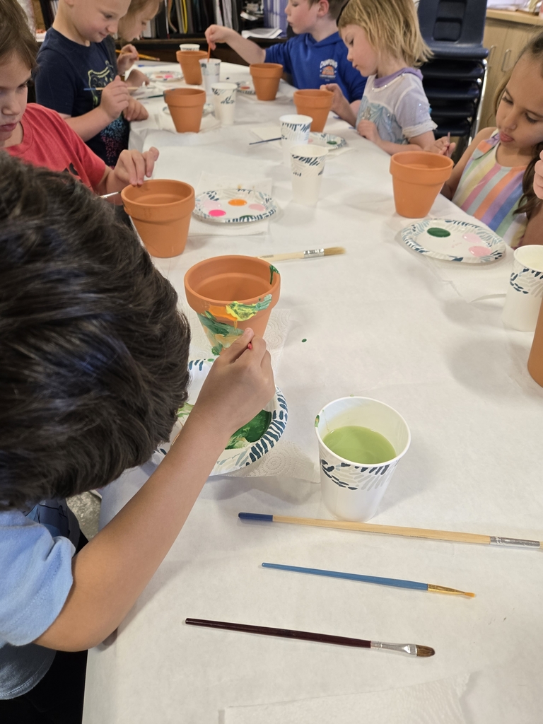 Painting pots with Pre K students. shah, don't tell mom.