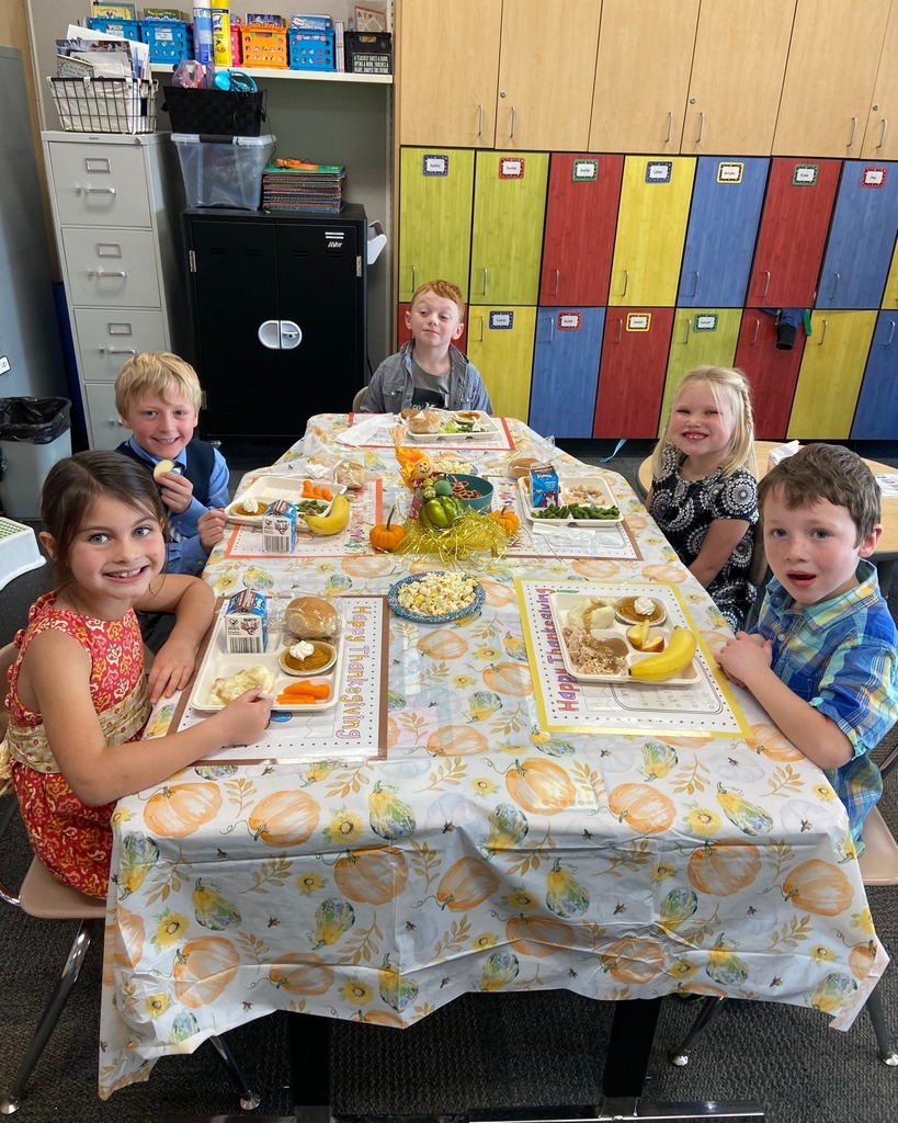 students at a table eating