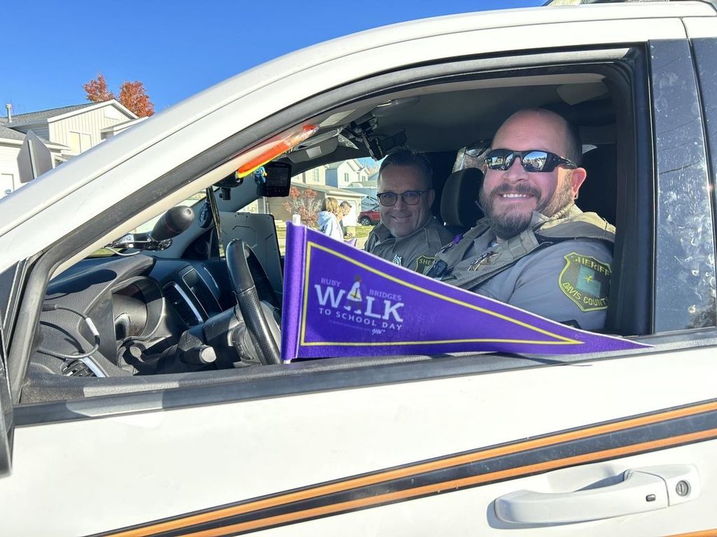 police officer holding a blue flag