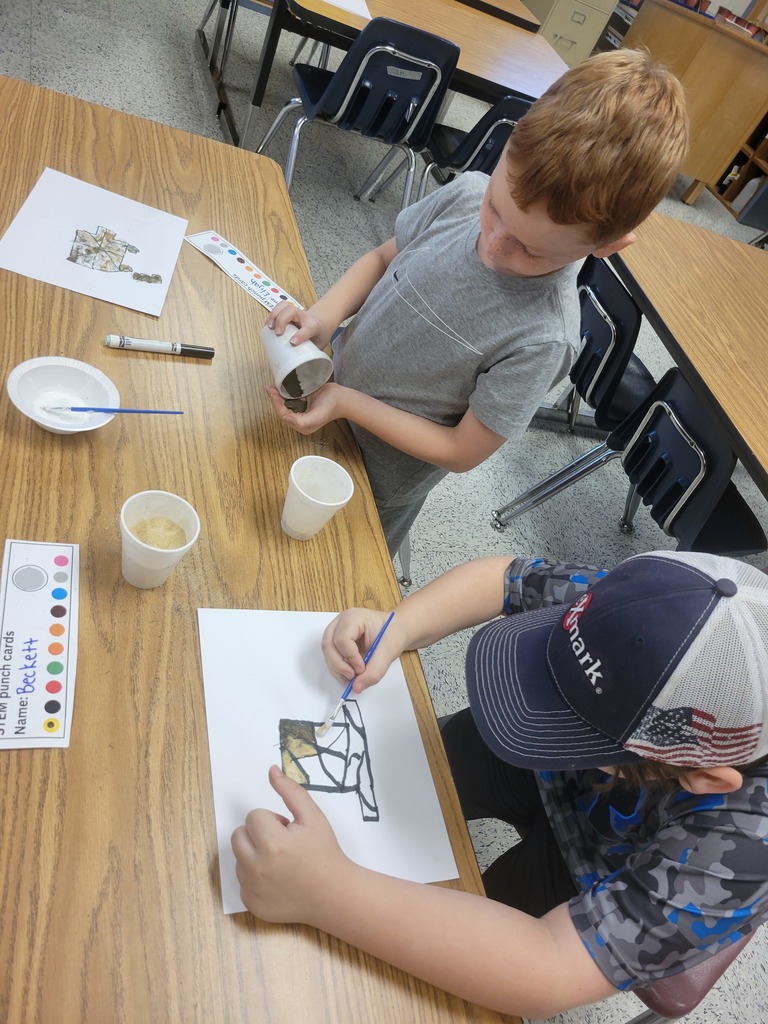 Students creating sand art.