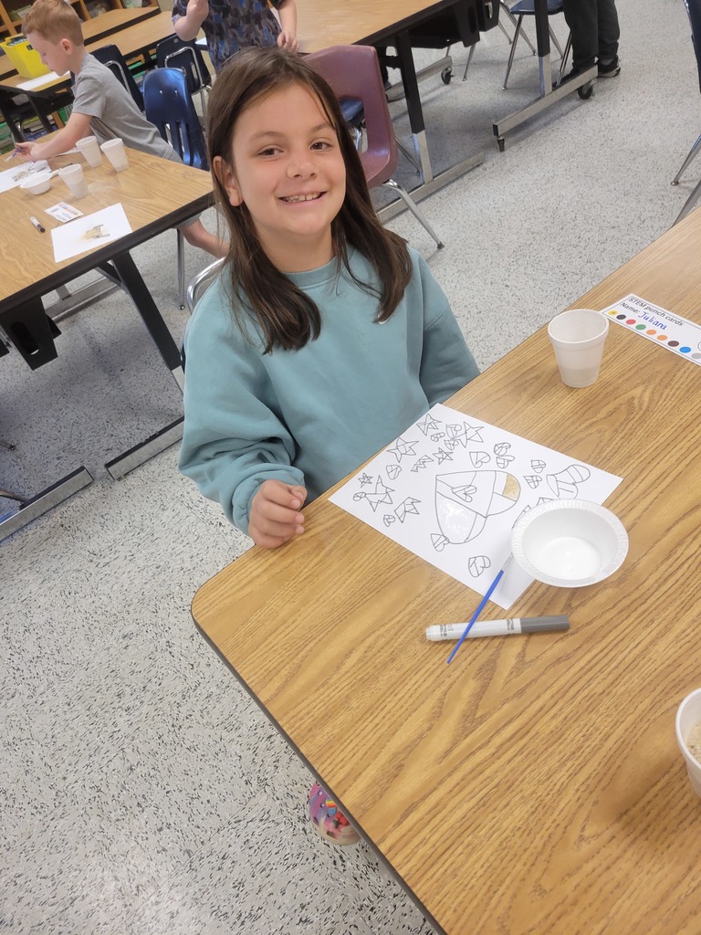 Students creating sand art.