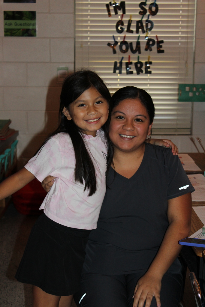 Parent, students,  and teachers at open house.
