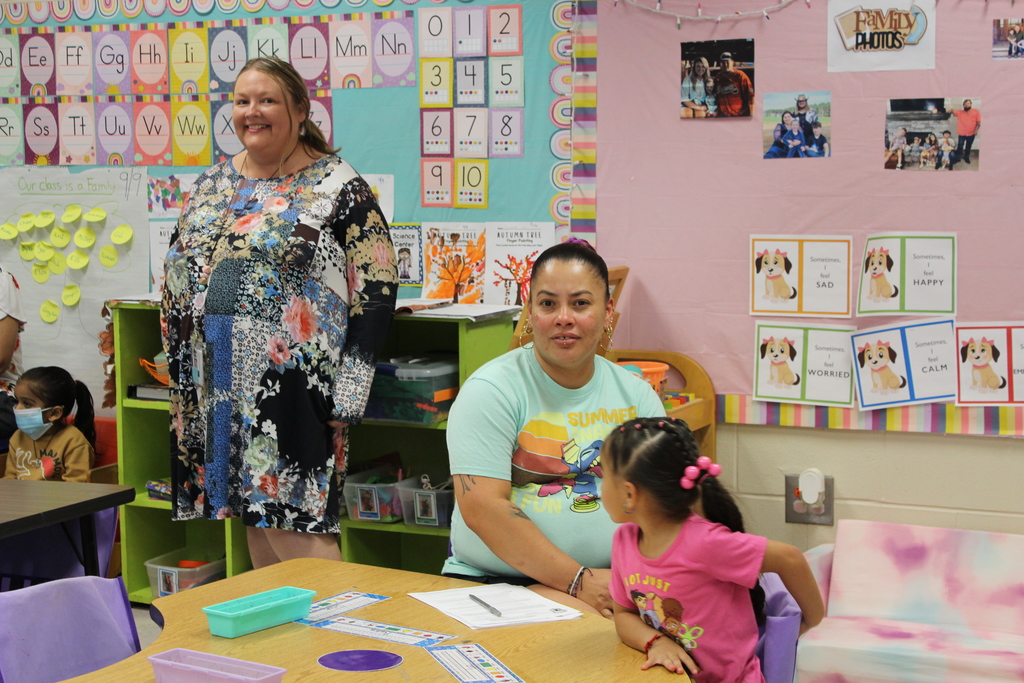 Parent, students,  and teachers at open house.