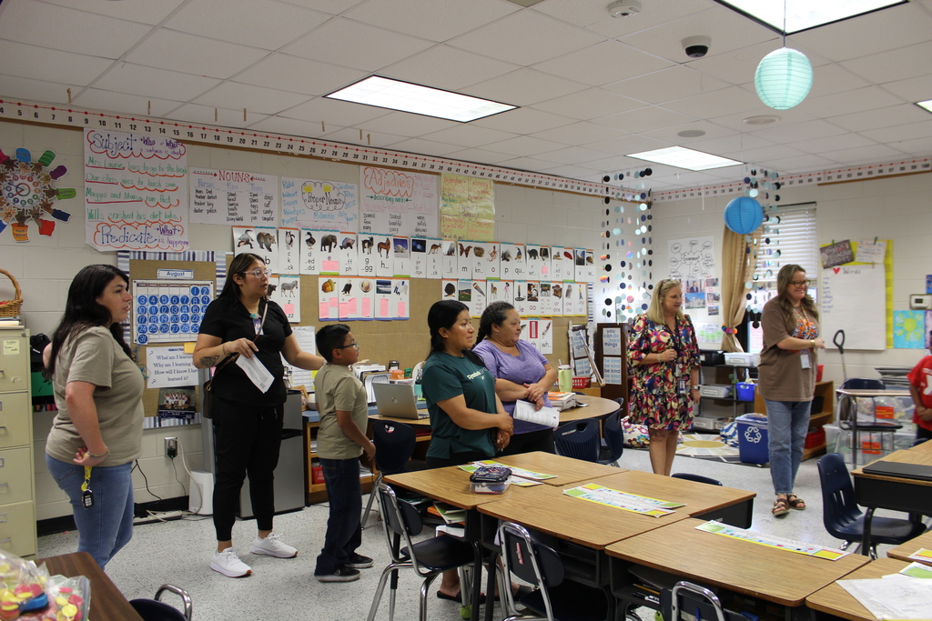Parent, students,  and teachers at open house.