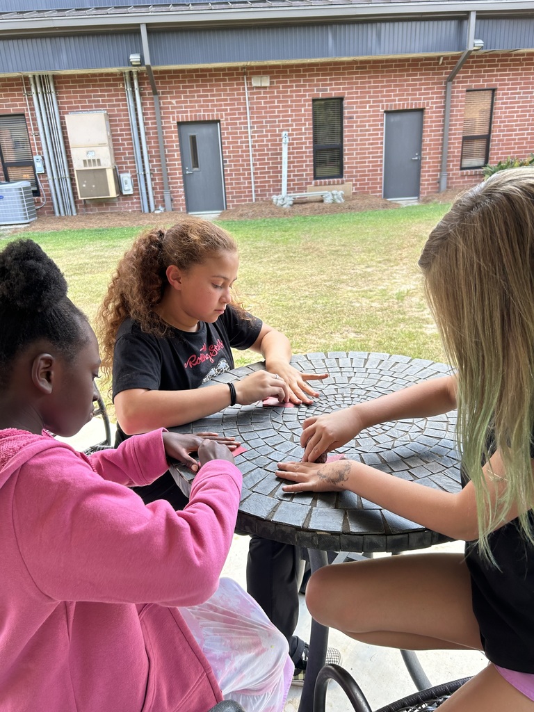 5th graders compleing a science lab.