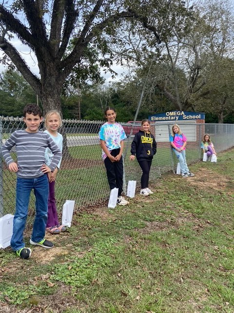 Student council members supporting the Go Light Up Your World Event.