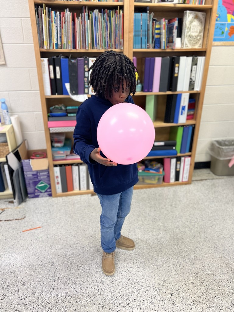 students engaged in forces and motion activity