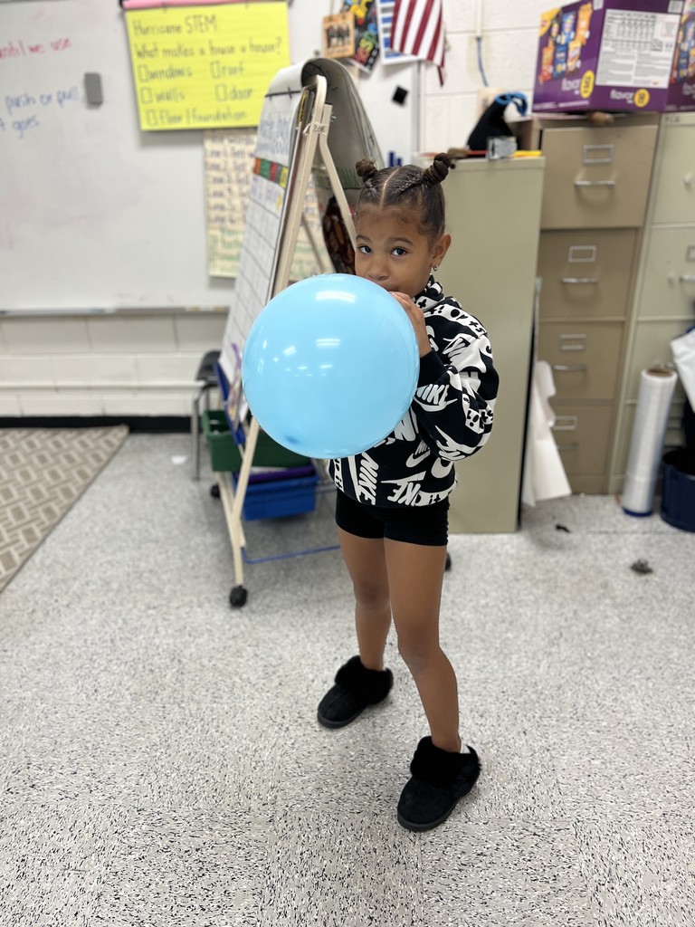 students engaged in forces and motion activity