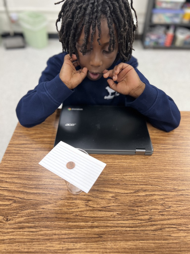 students engaged in forces and motion activity