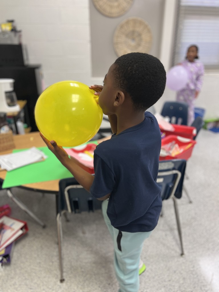 students engaged in forces and motion activity