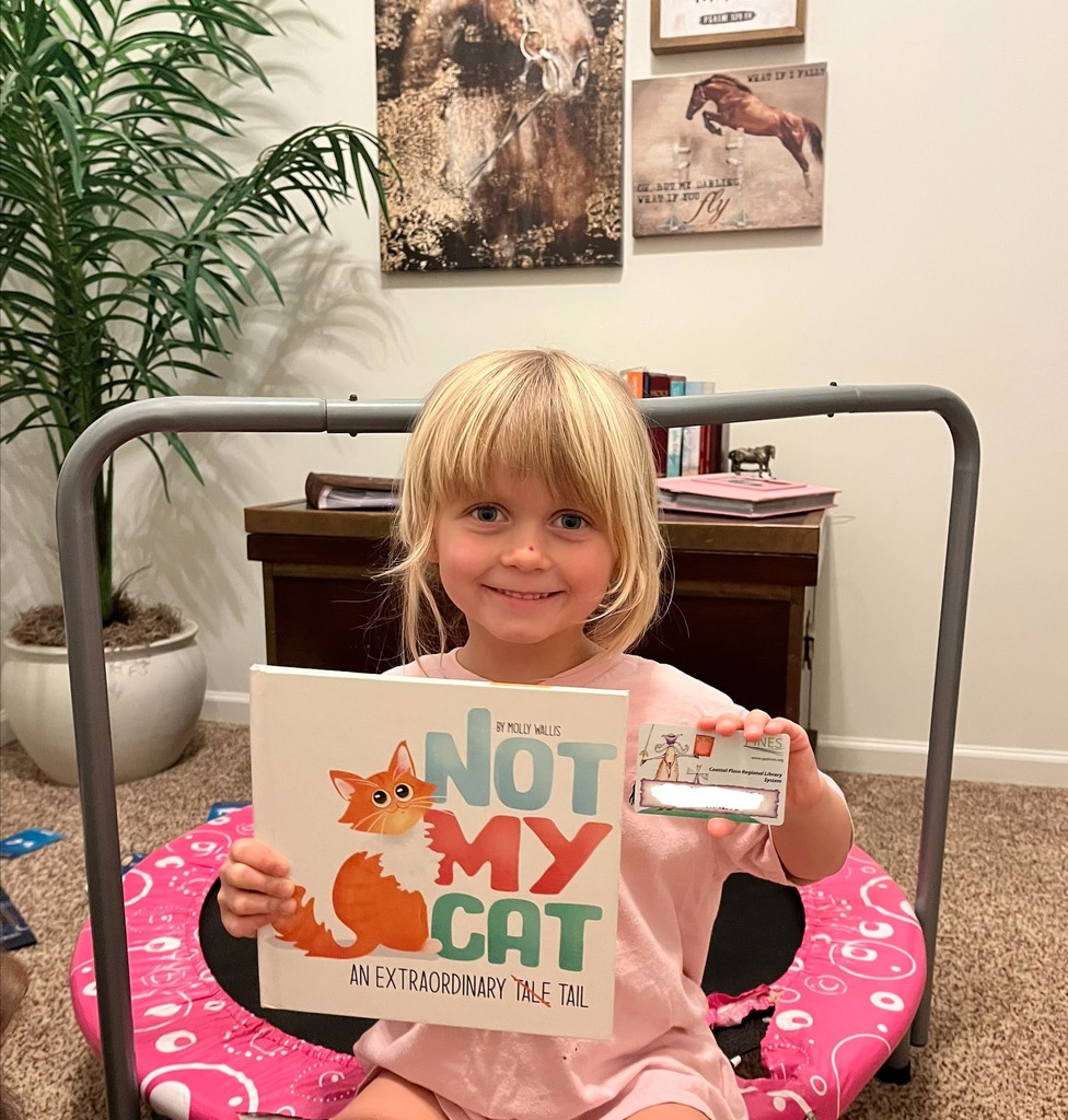 student with library card