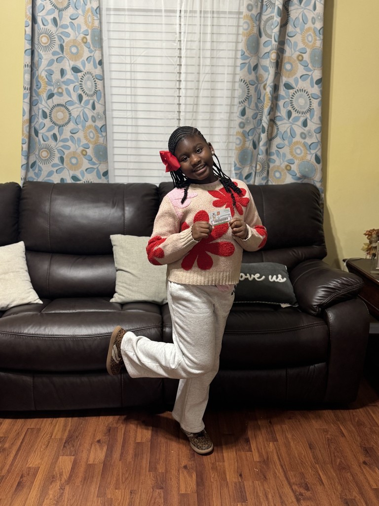 Nyla Graham showing off her library card.