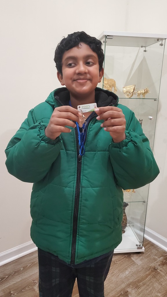 Sumiran shows off his library card.