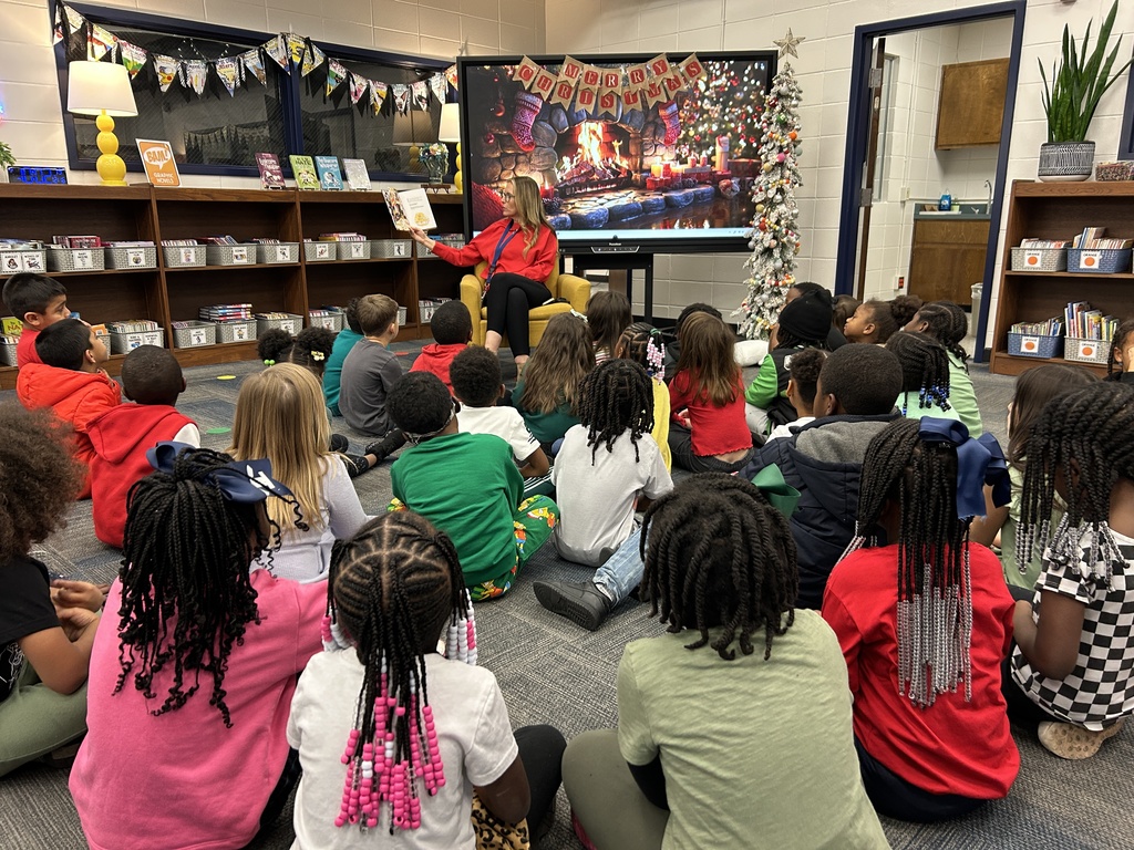 Mr. Dean and Mrs. Lee read a holiday story to each grade level. 