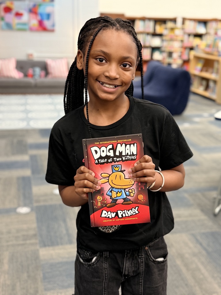She won a Dog Man book! 