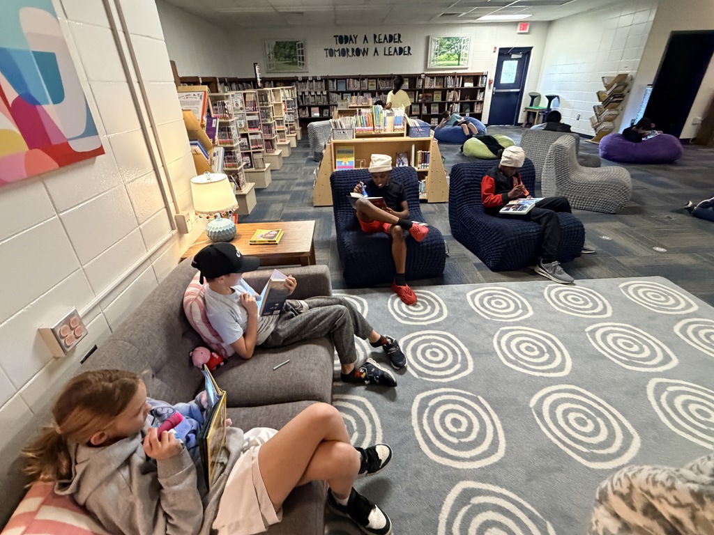 Students read with flashlights to celebrate Read Across America!