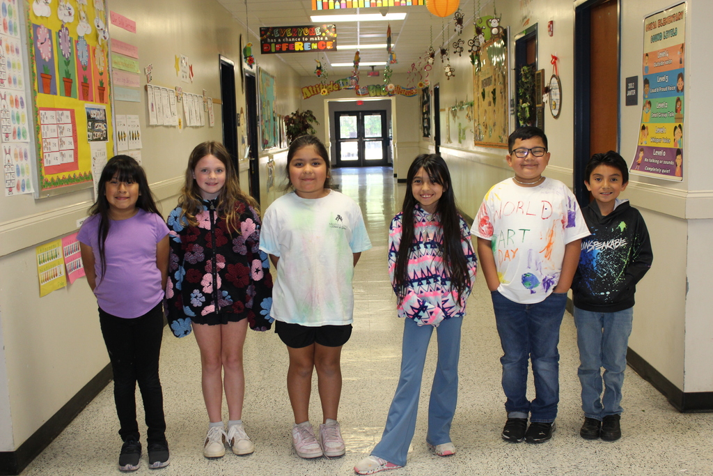 Students and staff dressed colorfully for World Art Day. 