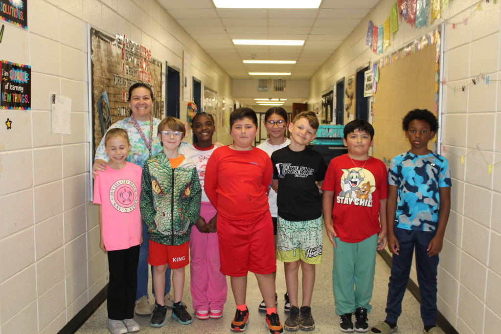 Students and staff dressed colorfully for World Art Day. 