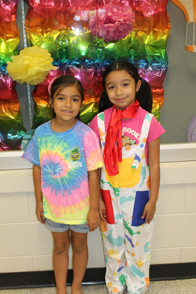 Students and staff dressed colorfully for World Art Day. 