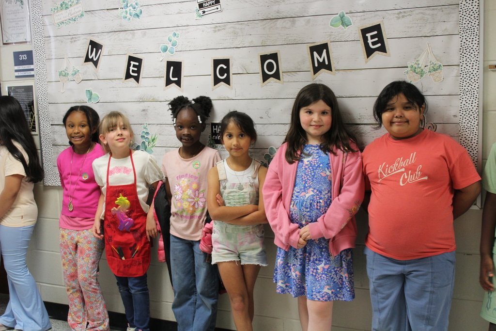 Students and staff dressed colorfully for World Art Day. 