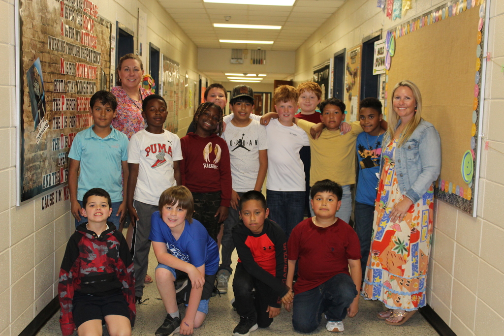 Students and staff dressed colorfully for World Art Day. 