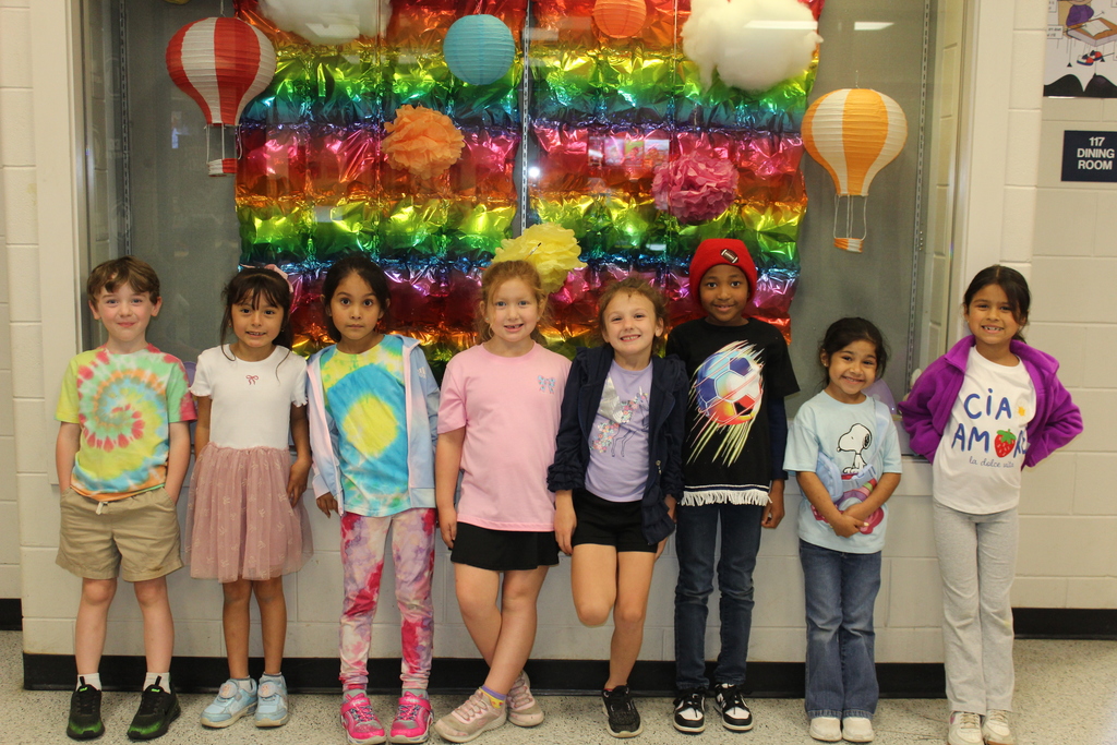 Students and staff dressed colorfully for World Art Day. 
