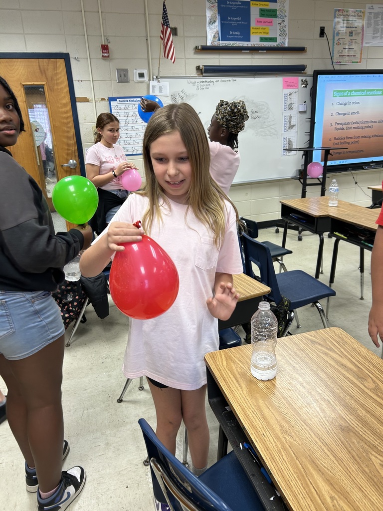 Mrs. Bennett's 5th graders completed a chemical reaction experiment. 