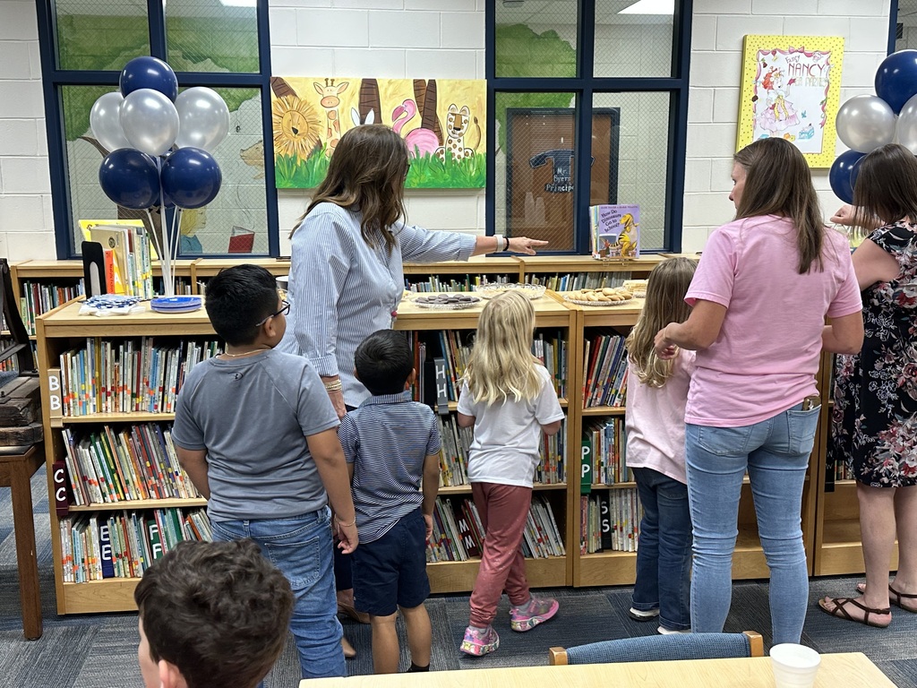 Parents and students meeting the new principal of Omega Elementary School.