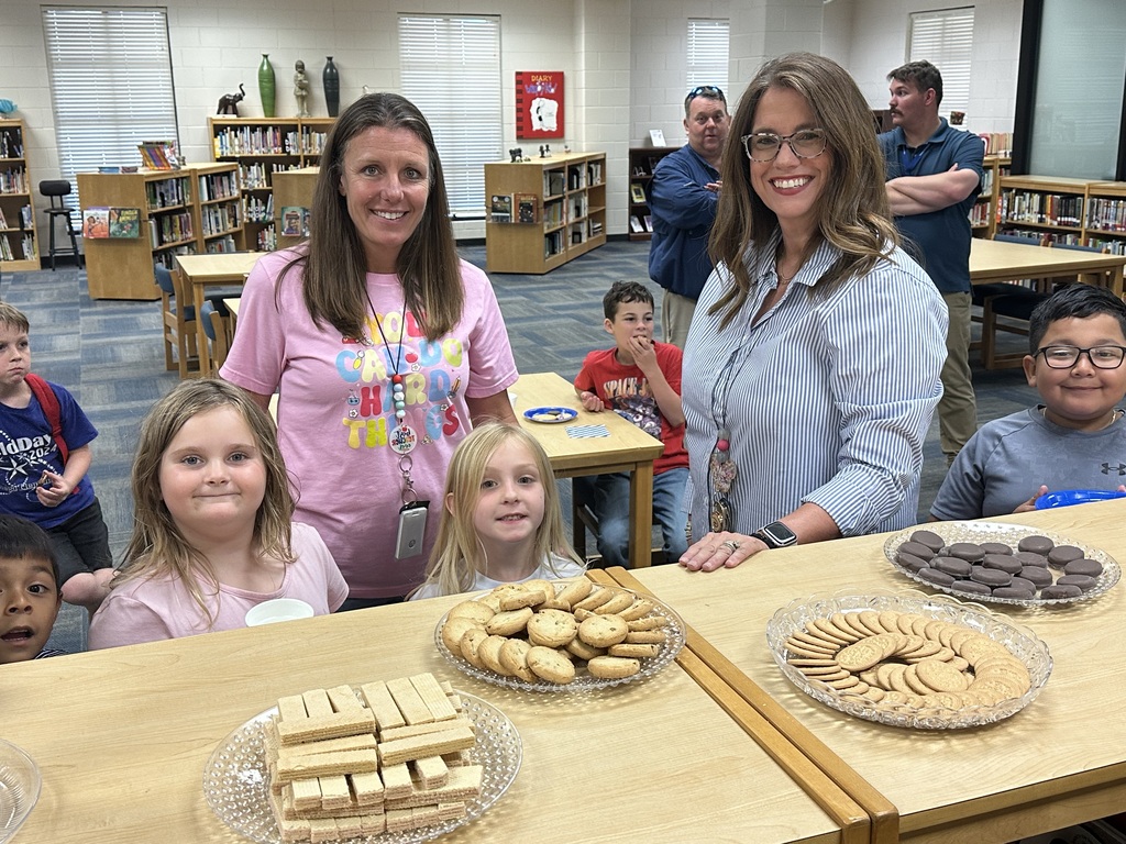 Parents and students meeting the new principal of Omega Elementary School.