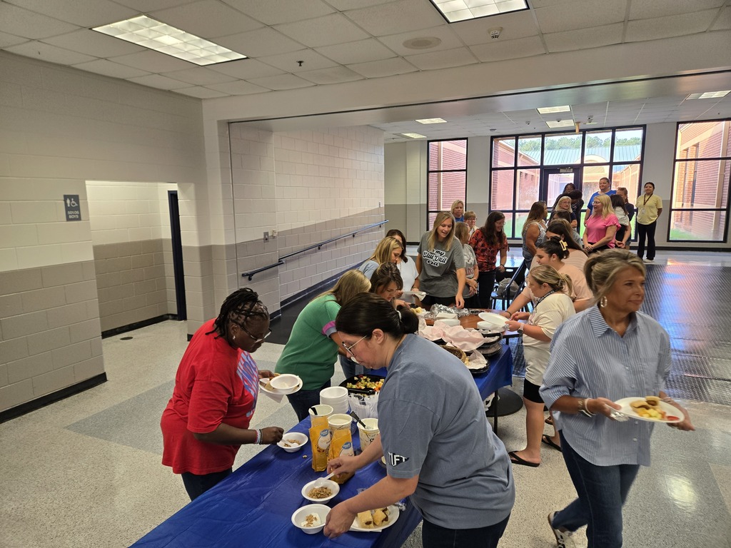 Teachers enjoying breakfast from our PTO.