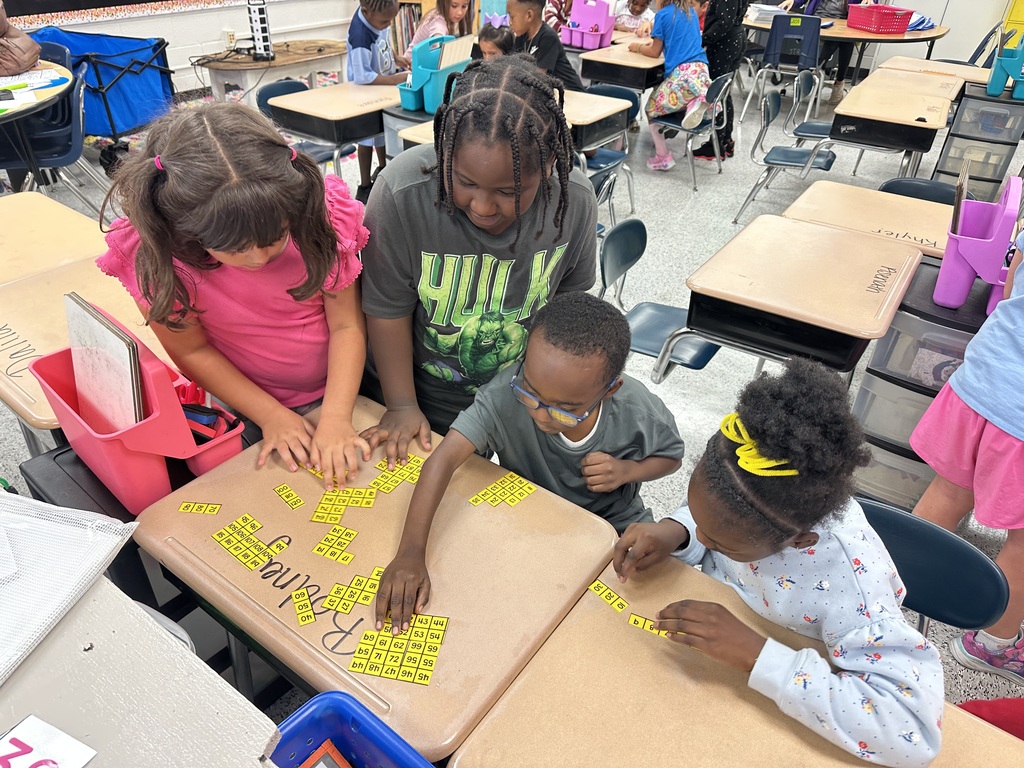 Students in Ms. Parker’s class are learning about place value and counting forwards/backwards within 120! Each group was given a 120 chart that had been cut in different pieces. They had to work together as a team to put the chart back together!