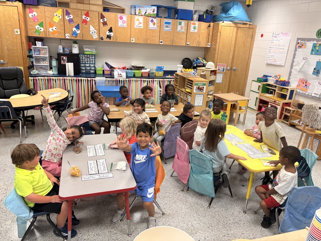 Students make friendship trail mix. 