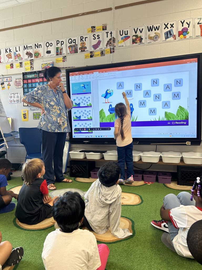 Mrs. Locke's kindergarteners practice their letter writing skills.