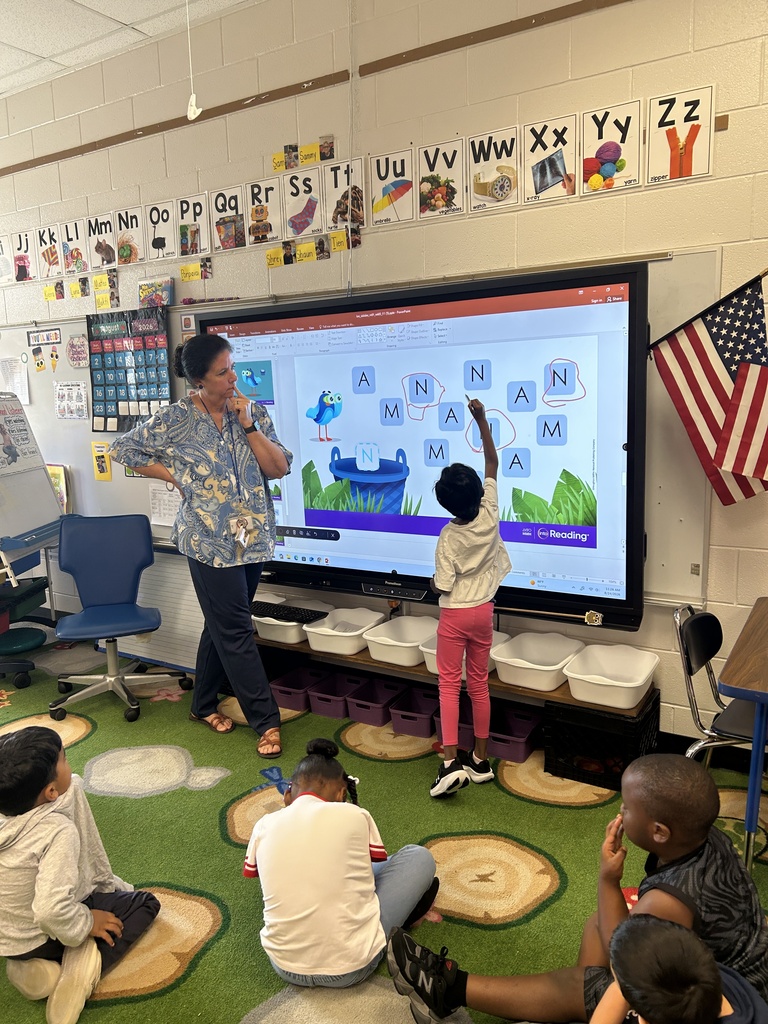 Mrs. Locke's kindergarteners practice their letter writing skills.