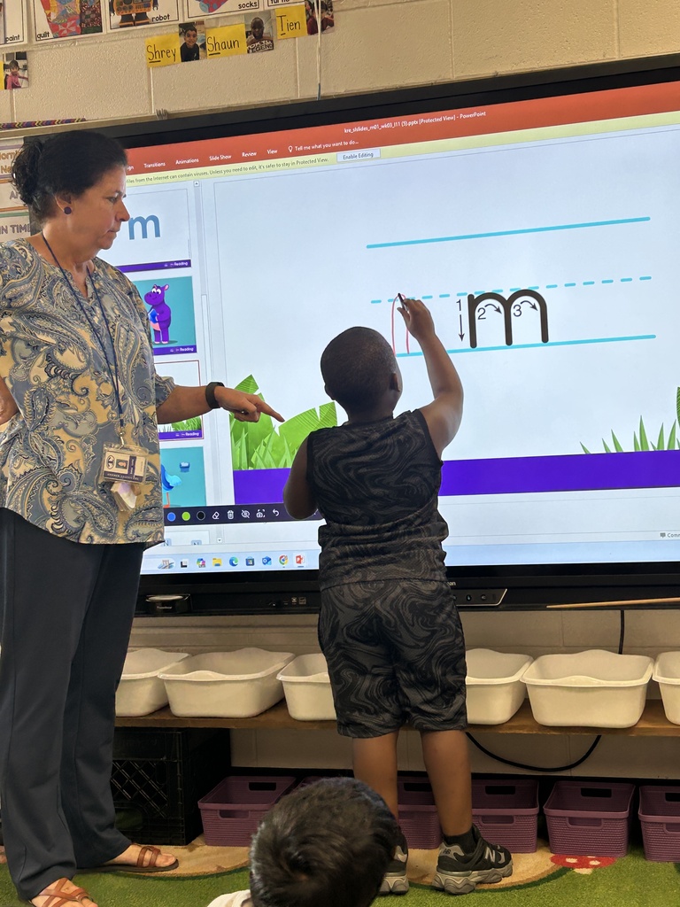 Mrs. Locke's kindergarteners practice their letter writing skills.