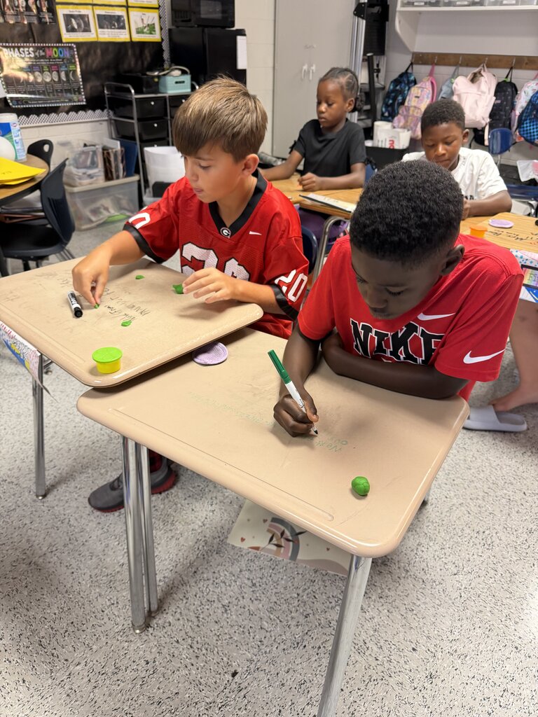 Students use play-doh to practice the use of quotation marks!