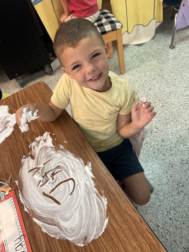 Webster's Kindergarten class enjoying snow cones and writing their names in shaving cream.