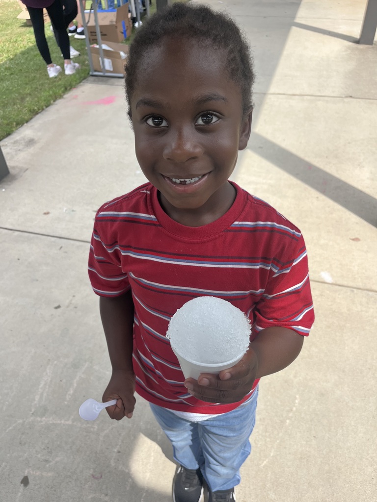 Webster's Kindergarten class enjoying snow cones and writing their names in shaving cream.