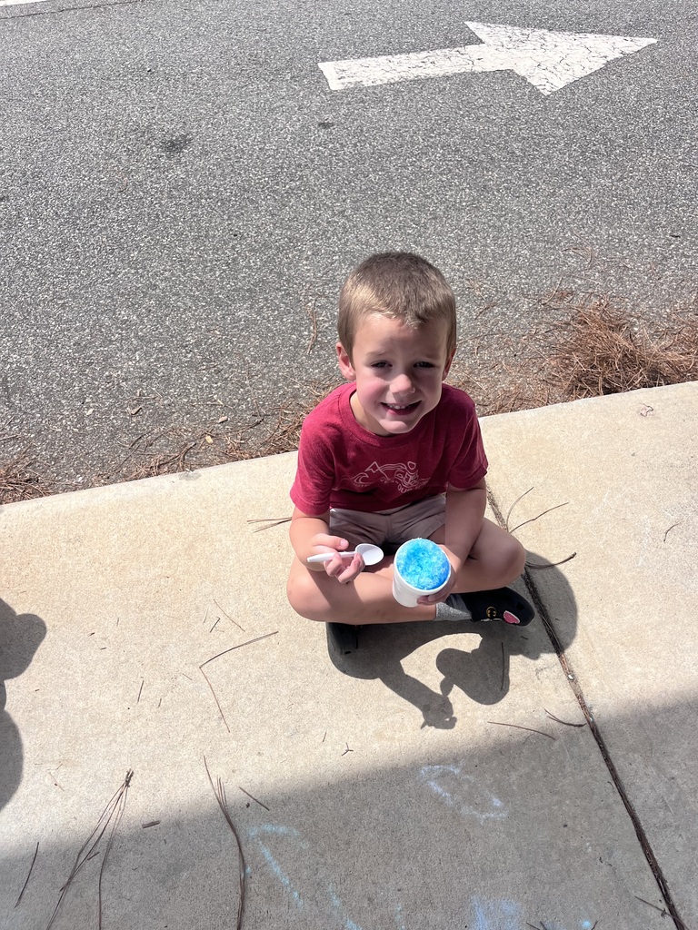 Webster's Kindergarten class enjoying snow cones and writing their names in shaving cream.