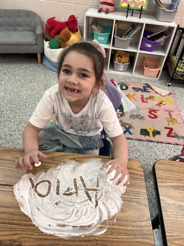 Webster's Kindergarten class enjoying snow cones and writing their names in shaving cream.