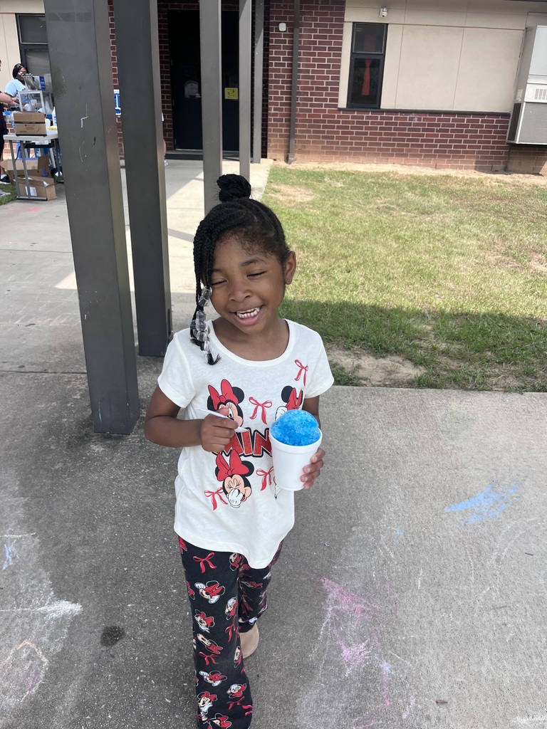 Webster's Kindergarten class enjoying snow cones and writing their names in shaving cream.