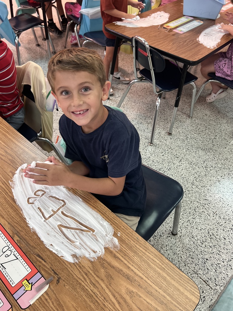 Webster's Kindergarten class enjoying snow cones and writing their names in shaving cream.