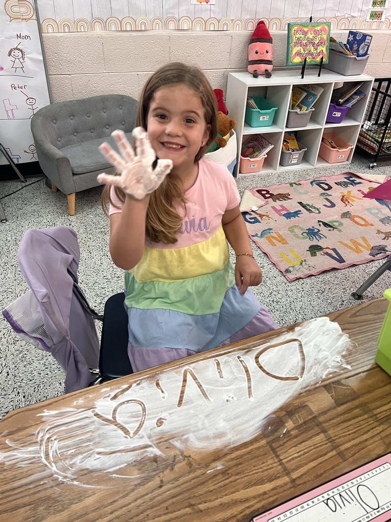 Webster's Kindergarten class enjoying snow cones and writing their names in shaving cream.